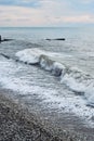 Beautiful sea landscape. Strong powerful sea waves break on shingle sea shore. Dangerous power of element of water