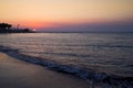 beautiful sea landscape with a sunset. evening purple sky with clouds over ocean. sea surf with waves.Bright and dynamic Royalty Free Stock Photo