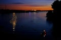 Beautiful sea, river landscape with houses and a thermal power plant on the far bank of Wiesbaden in Germany, moon and is Royalty Free Stock Photo