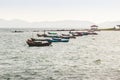 Beautiful sea, sand and fishing boats with mountain and blue sky Royalty Free Stock Photo