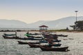 Beautiful sea, sand and fishing boats with mountain and blue sky Royalty Free Stock Photo