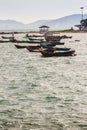 Beautiful sea, sand and fishing boats with mountain and blue sky Royalty Free Stock Photo