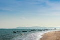 Beautiful sea, sand and fishing boats with mountain and blue sky Royalty Free Stock Photo