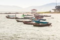 Beautiful sea, sand and fishing boats with mountain and blue sky Royalty Free Stock Photo