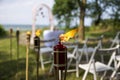 Wedding decoration of white chairs, arc of flowers awaits its bridegroom.