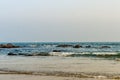 Wild Empty Tropical beach, blue sky, sunlight reflextions on the shore at sunset time on a sunny day in in as landscape style may Royalty Free Stock Photo