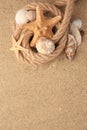 Beautiful sea stars, shells and rope on sand, flat lay. Space for text Royalty Free Stock Photo