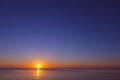 A beautiful sea sunset with a clear, cloudless sky Royalty Free Stock Photo