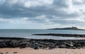 Beautiful sea view from a beach under a cloudy blue sky Royalty Free Stock Photo