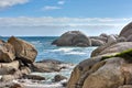 Beautiful sea view of big boulders and ocean water on a sunny beach day in summer. A seaside view of nature with a blue