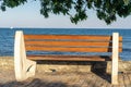 Beautiful sea view and boats with empty bench in the foreground, moviÃÂµ frame