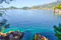 Beautiful sea view. The mountains descend into the sea. Blue sky and turquoise water. Adriatic Sea. Montenegro. Royalty Free Stock Photo