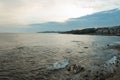 Beautiful sea view with waves with rocks in the evening at sunset near the city of Malaga. Spain. Seascape. Royalty Free Stock Photo