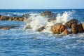 Beautiful sea wave background with rocky shore and foam. Contrast portrait