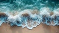 Beautiful sea wave with foam on the sandy beach. Top view. Royalty Free Stock Photo