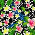 Beautiful seamless floral jungle pattern background. Tropical flowers and palm leaves on leopard print Royalty Free Stock Photo