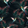 Beautiful seamless vector floral summer pattern background with hummingbird and bright palm leaves. Royalty Free Stock Photo