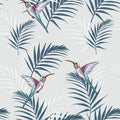 Beautiful seamless vector floral summer pattern background with hummingbird and palm leaves. Royalty Free Stock Photo