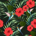 Beautiful seamless vector floral summer pattern background with hummingbird, red hibiscus flowers and palm leaves. Royalty Free Stock Photo