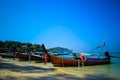 Beautiful seascape of the beach in Thailand and Thai traditional boats at the coast. Royalty Free Stock Photo