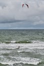 Beautiful seascape with kitesurfer, riding waves.