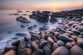 Beautiful seascape with long exposure of rocks and sea at sunset