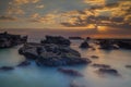 Beautiful seascape. Long exposure rocky beach during low ride. Panoramic ocean view. Composition of nature. Sunset scenery Royalty Free Stock Photo