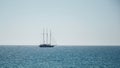 Beautiful seascape. Minimalistic view of the sea and sailing ship in the early morning. Sailing in the sea in the morning sunlight Royalty Free Stock Photo