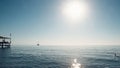 Beautiful seascape. Minimalistic view of the sea and sailing ship in the early morning. Sailing in the sea in the morning sunlight Royalty Free Stock Photo