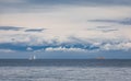 Beautiful seascape morning sea horizon and cloudy sky. Tranquil scene. Beautiful two white yachts in the distance Royalty Free Stock Photo