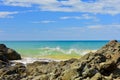 Seashores of New Zealand; beautiful seascape and bright blue ocean. Rocky foreground with clear and colourful waves.