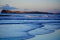Seashores of New Zealand; beautiful seascape, bright blue ocean, and a small island far away