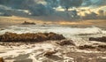 Beautiful seascape, ocean views, rocky coast, sunlight on the horizon. Composition of nature. Sunset scenery background. Cloudy Royalty Free Stock Photo