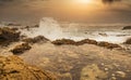 Beautiful seascape, ocean views, rocky coast, sunlight on the horizon. Composition of nature. Sunset scenery background. Cloudy Royalty Free Stock Photo