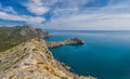 Beautiful seascape, panorama of cape Kapchik to the Galitsin Trail and blue bay of the Black Sea. Sudak, New World. Landscape of