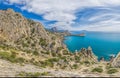 Beautiful seascape, panorama of cape Kapchik to the Galitsin Trail and blue bay of the Black Sea. Sudak, New World. Landscape of