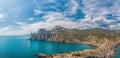 Beautiful seascape, panorama of cape Kapchik to the Galitsin Trail and blue bay of the Black Sea. Sudak, New World. Landscape of