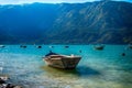 Beautiful seascape with resting boats with mountains and forest in the background