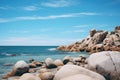 Beautiful seascape with rocks and blue sky, Thailand. Big rocks on the ocean landscape beach view with blue sky, AI Generated Royalty Free Stock Photo