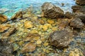 Beautiful seascape. Sea surface, rocks on the beach. Close-up cliff and stone on the shore.