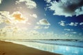 Beautiful seascape with sea waves, blue sky, white cumulus clouds and sand beach. Summer vacation tropical landscape. Royalty Free Stock Photo