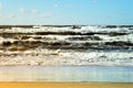 Beautiful seascape with sea waves, blue sky, white cumulus clouds and sand beach. Summer vacation tropical landscape. Royalty Free Stock Photo