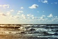 Beautiful seascape with sea waves, blue sky and white cumulus clouds. Summer vacation tropical landscape. Royalty Free Stock Photo