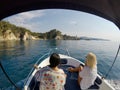 Beautiful seascape of two girls sailing a rental boat at the Mediterranean Sea in the Spain Costa Brava