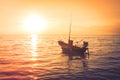 Beautiful seascape view the fishing boat floating on the sea with sunset light in the background. Royalty Free Stock Photo