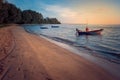 Beautiful seascape view the fishing boat floating on the sea with sunset light in the background. Royalty Free Stock Photo