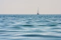 Beautiful seascape - view of morning sea with a sailboat on horizon in the bay next to of ancient Phaselis, coast of the Mediterra Royalty Free Stock Photo