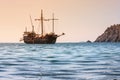 Beautiful seascape - view of morning sea with tourist sightseeing ship in the bay next to of ancient Phaselis, coast of the Medite Royalty Free Stock Photo