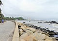 Beautiful seascape view with the rocky shoreline with a cement dam and a small road