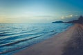 Beautiful seascape view of sand beach with sea and island in the background at twilight time at Chao Lao Beach. Royalty Free Stock Photo